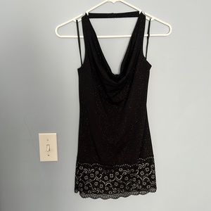 Fancy black halter top with lace bottom detailing.